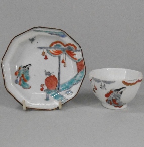 a chelsea lady in a pavillion pattern teabowl circa 1752 and an earlier and similar japanese saucer 